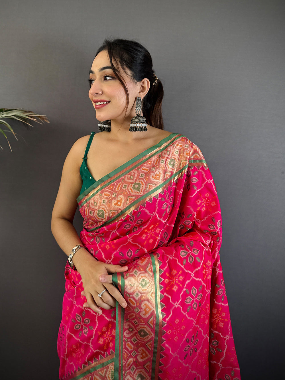 Rani Pink Patola Banarasi Silk Saree with Green Contrast Border & Zari Weaving