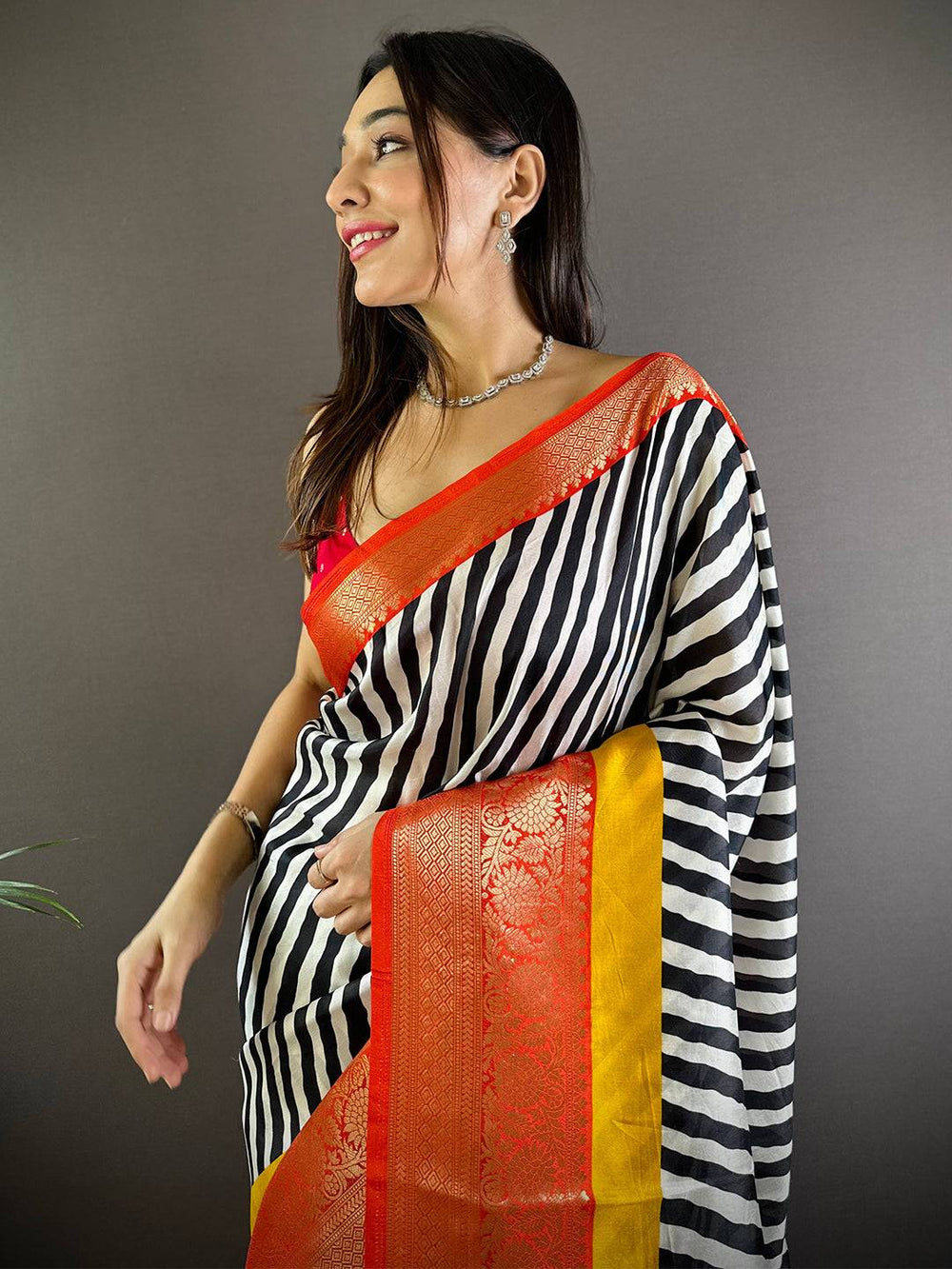 Black & White Striped Banarasi Silk Saree with Yellow-Orange Zari Border