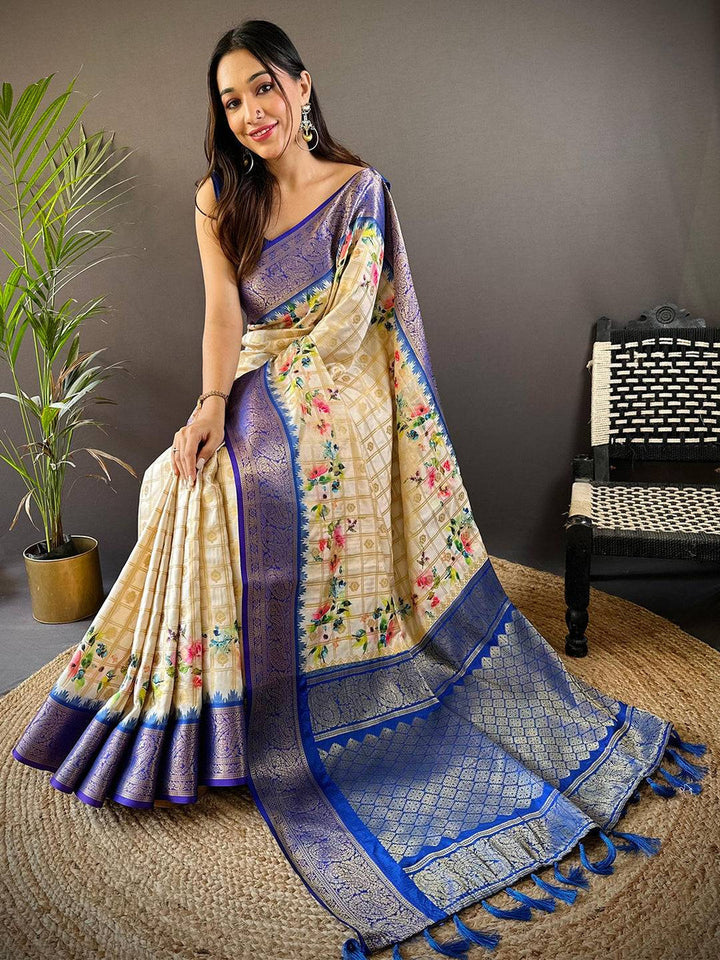 Cream Floral Banarasi Silk Saree with Royal Blue Zari Border & Tassel Pallu