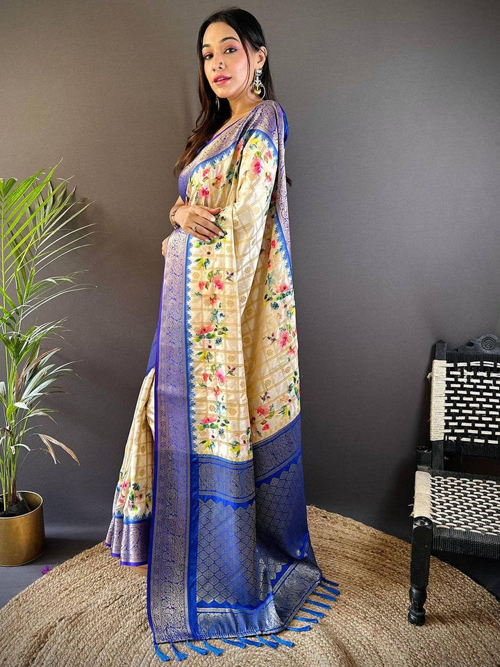 Cream Floral Banarasi Silk Saree with Royal Blue Zari Border & Tassel Pallu