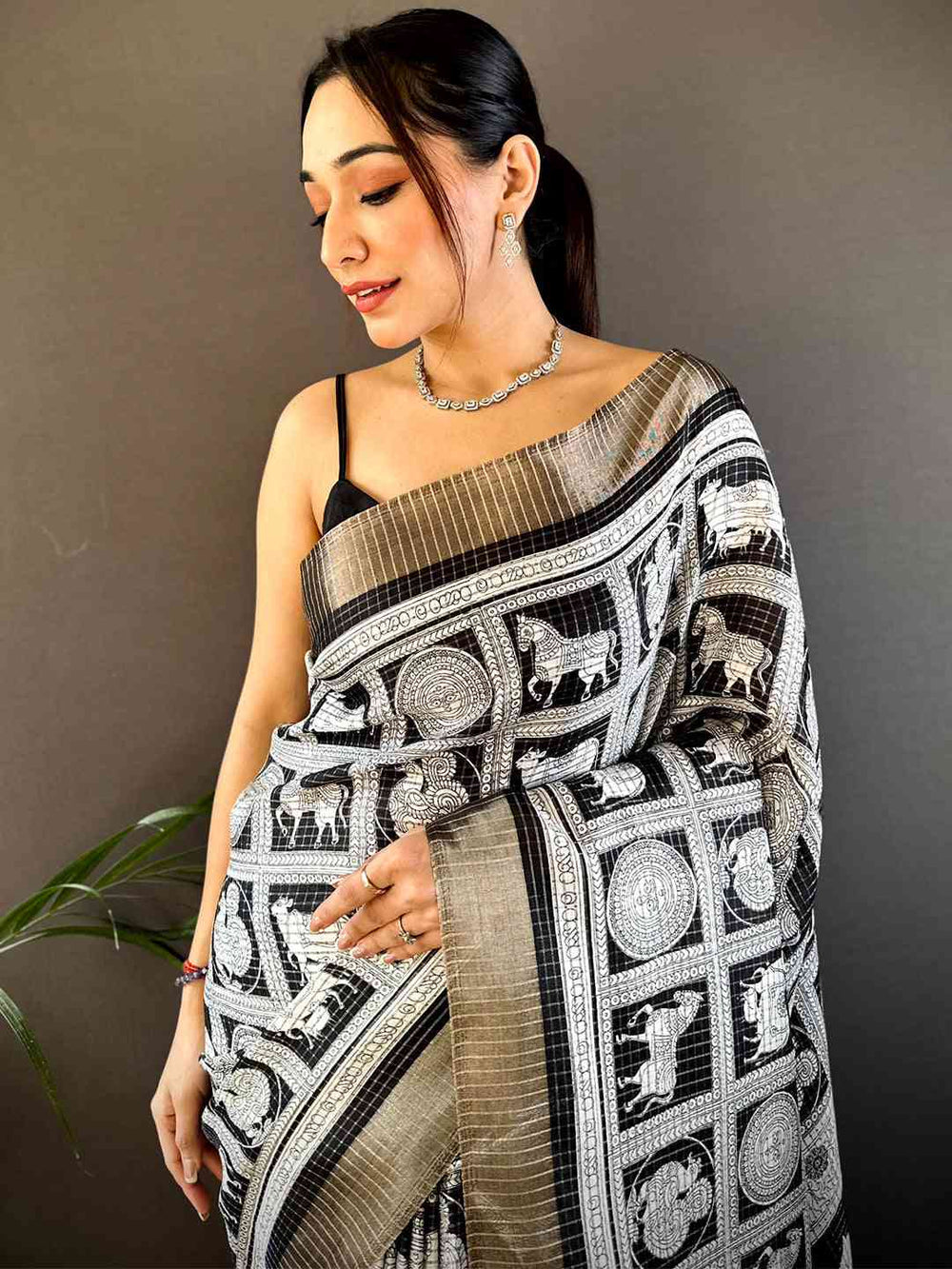 Black & White Printed Silk Saree with Artistic Motifs and Tassel Pallu