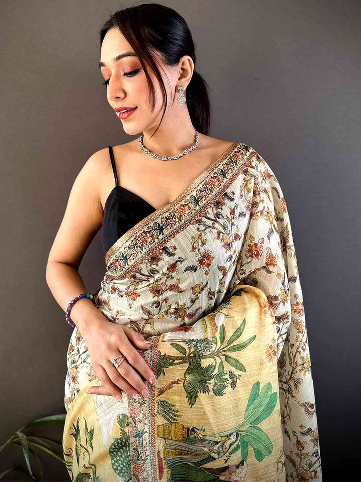 Cream Printed Silk Saree with Ethnic Village Scene Pallu & Designer Border